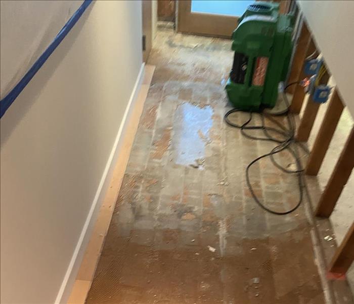 Floors being dried and repaired after water damage